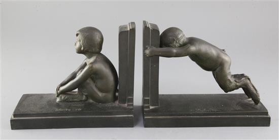Paul Silvestre (French 1884-1976). A pair of early 20th century patinated bronze bookends, Susse Freres, Paris, length 8.25in.